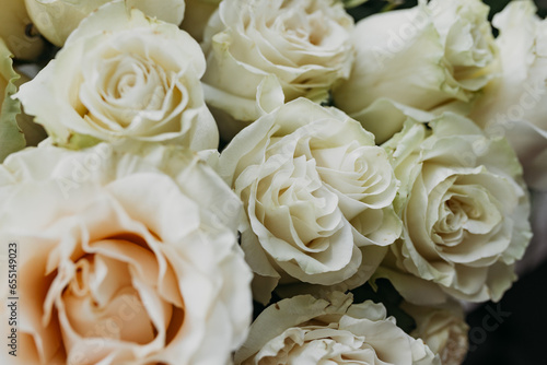 Flower composition of light beige roses, close up.
