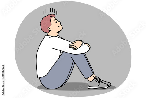 Unhappy young man sit on floor suffer from loneliness and repetitive thoughts. Stressed male struggle with depression or anxiety. Vector illustration.