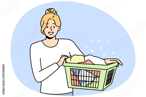 Smiling young woman with basket with clothes going to laundry. Happy girl cleaning clothing in laundromat. Vector illustration.