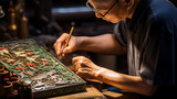 A craftsman making mother-of-pearl lacquerware