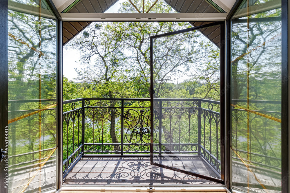 Window in the house with views of nature and the river in the summer