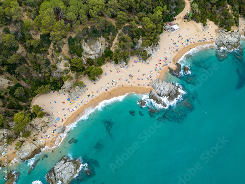 Resort town on the Mediterranean coast in Spain. Drone view of the beach in the town of Lloret De Mar. Cala Sa Boadella © Andreas May