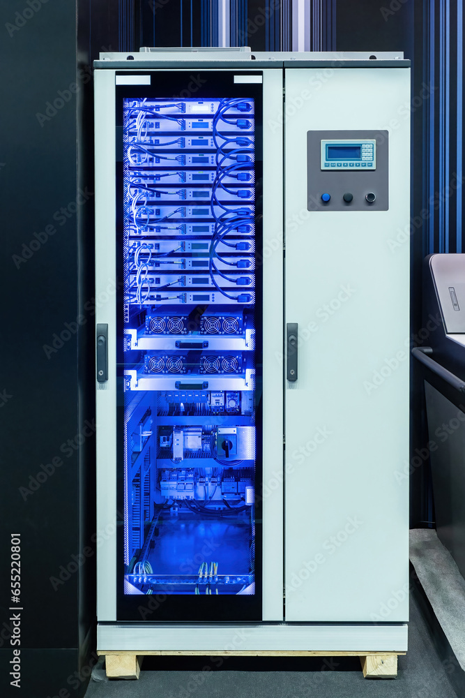 Server equipment. Cabinet with telecommunications equipment. Servers with wires for production automation. Modern telecommunications equipment. Telecommunication tech. Server cabinet with neon glow Server equipment. Cabinet with telecommunications equipment. Servers with wires for production automation. Modern telecommunications equipment. Telecommunication tech. Server cabinet with neon glow