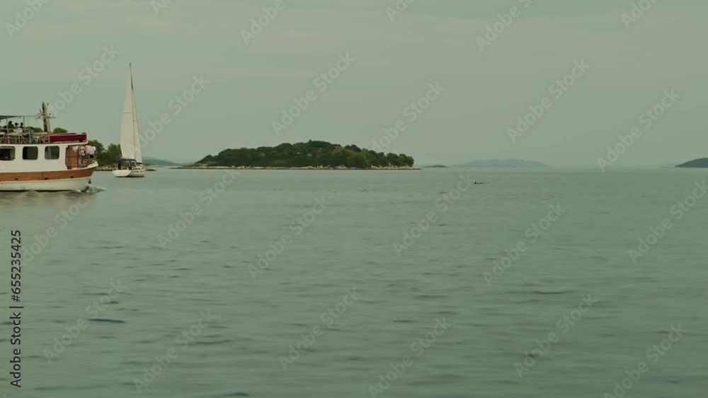 ship at sea. blue sea . beautiful landscape. big rocks and mountains. ship on the waves ship at sea. blue sea . beautiful landscape. big rocks and mountains. ship on the waves