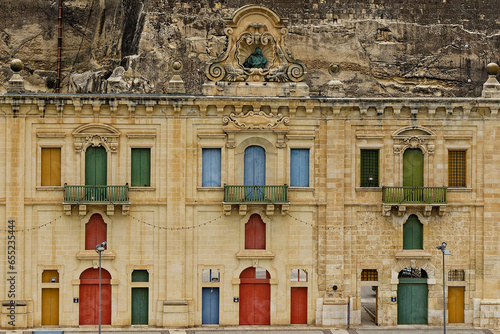Brightly coloured doors and shutters in and old Mediterranean architecture (Valletta Malta) 