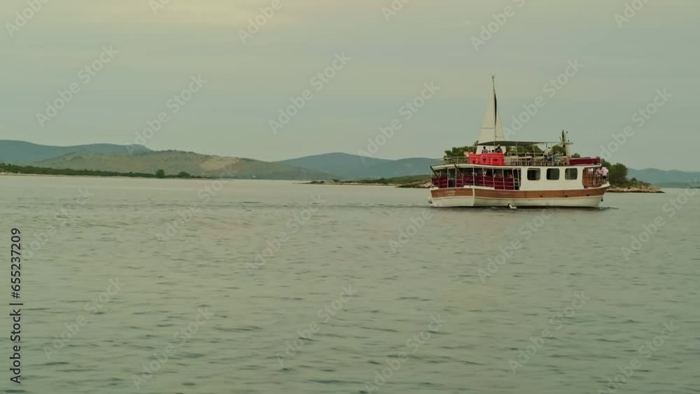 ship at sea. blue sea . beautiful landscape. big rocks and mountains. ship on the waves ship at sea. blue sea . beautiful landscape. big rocks and mountains. ship on the waves