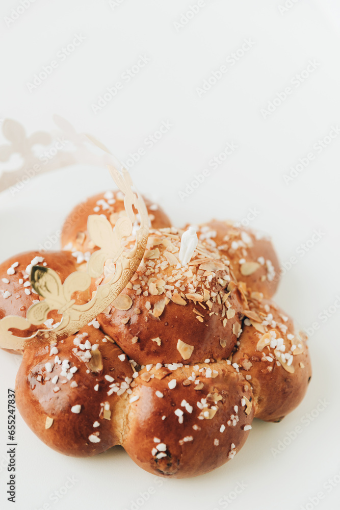 Three Kings Cake with a golden crown an tiny king hidden inside. Swiss tradition to bake Dreikönigskuchen on January 6.