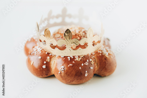 Three Kings Cake with a golden crown an tiny king hidden inside. Swiss tradition to bake Dreikönigskuchen on January 6 known as Dreikönigstag