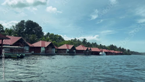 boat view of the tropical island in Kerala, India, luxurious resorts on sea side