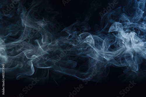 Close up view of smoke on a black background. Can be used for abstract or atmospheric concepts.