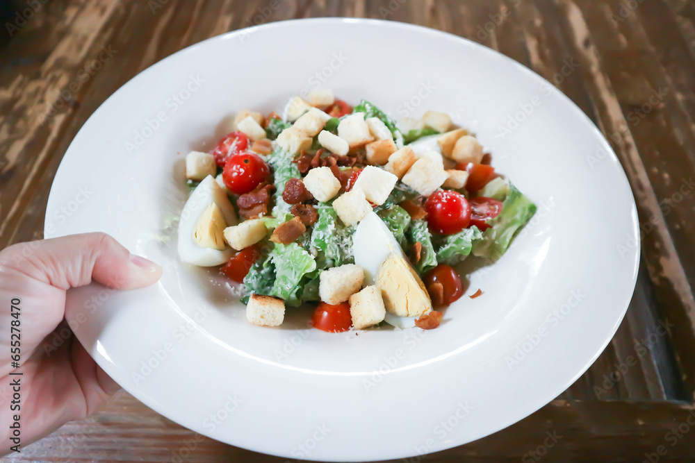 caesar salad or vegetable salad with bacon and boiled egg , Bread Croutons and cheese