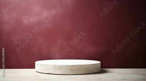 Round Stone Podium in front of a burgundy Studio Background. White Pedestal for Product Presentation