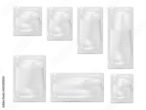 Blank white sachet packet with tear notches. Vector mock-up set. Plastic, paper or foil pouch bag template. Food, medical or cosmetic product individual package kit mockup