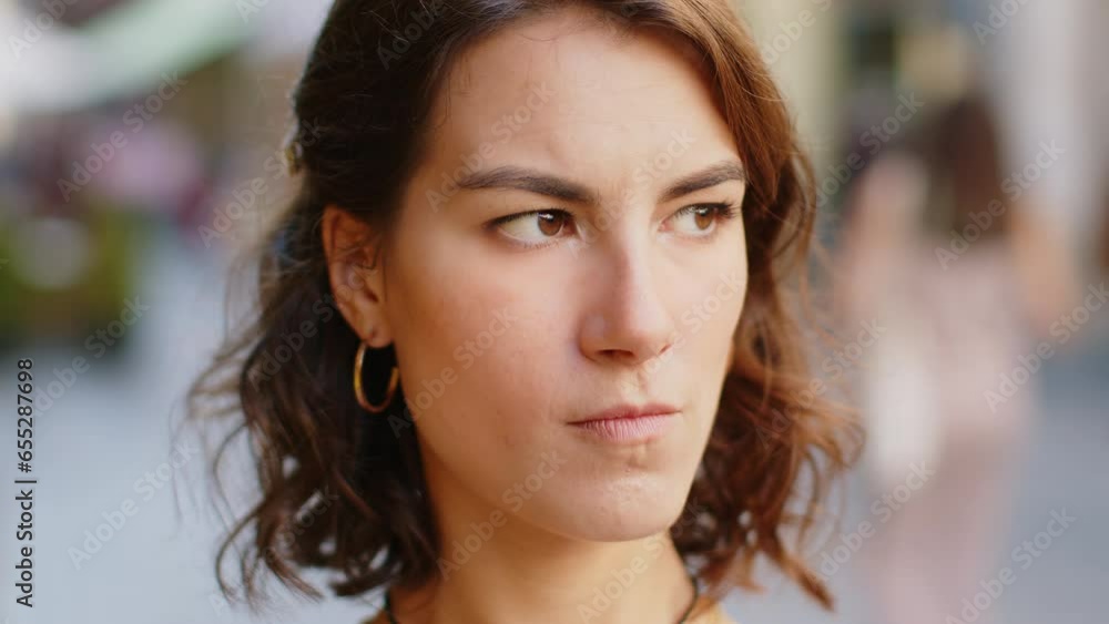 Close-up portrait sad unhappy woman thinks over life concerns, suffers from unfair situation. Problem, feeling bad, annoyed, burnout, grief. Frustrated depressed lonely girl standing in city street Close-up portrait sad unhappy woman thinks over life concerns, suffers from unfair situation. Problem, feeling bad, annoyed, burnout, grief. Frustrated depressed lonely girl standing in city street