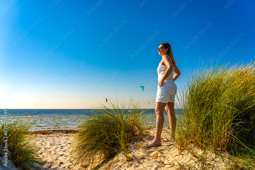 Beautiful woman walking on sunny beach
Beautiful woman walking on sunny beach