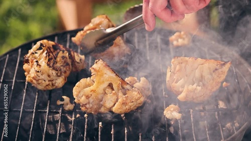 Pieces of cauliflower are cooked on the grill