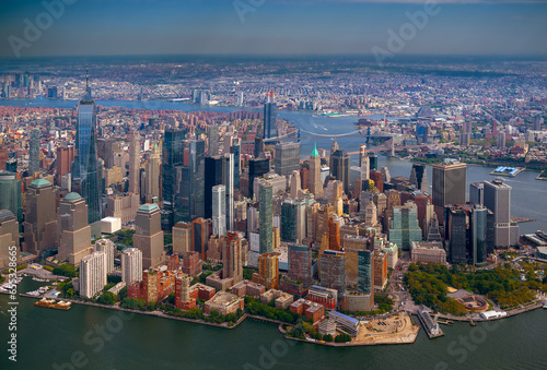 Aerial cityscape about The New york city's skyscrapers. Lower Manhattan business distict with One world trade center. Brooklyn is on the background with East river, Manhattan and Brooklyn bridges.
