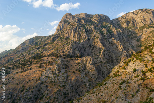 Mountain in Kotor, Montenegro in the evening, illuminated by sunset rays