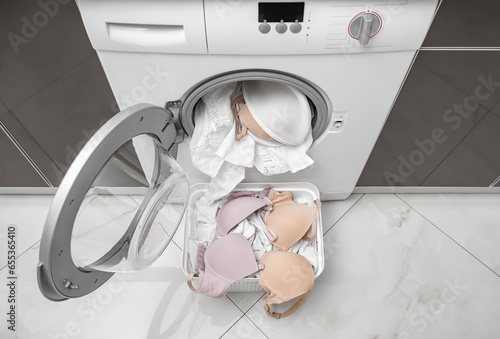 Washing a bra in a washing machine. There is a cover for linen.