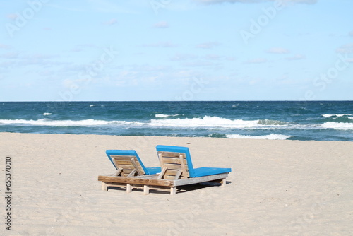 Fototapeta Naklejka Na Ścianę i Meble -  Beach chairs on a clear summer day