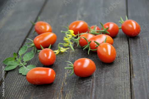 Fresh tomatoes on a wooden background