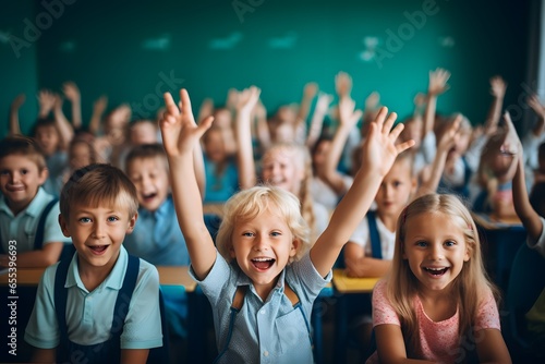 School children in classroom. Children raising hands up and having fun in class.