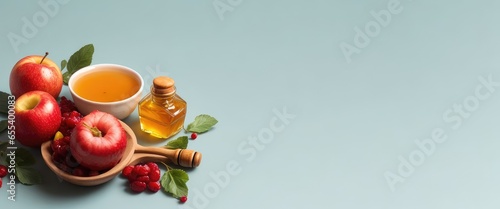 On a light background, a composition of ripe fruits and a bowl of honey. Rosh Hashanah (Jewish New Year) celebration. Copy space for text, advertising, message, logo