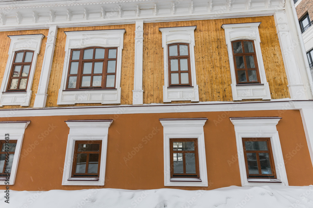 Obraz premium Building and houses in winter season. Snow in city and town architecture