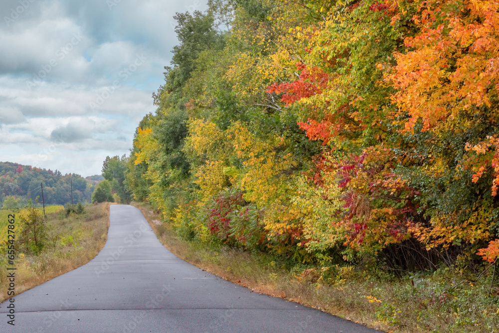Rolling country backroads during autumn with brilliant fall colors near Chippewa Falls Wisconsin Rolling country backroads during autumn with brilliant fall colors near Chippewa Falls Wisconsin