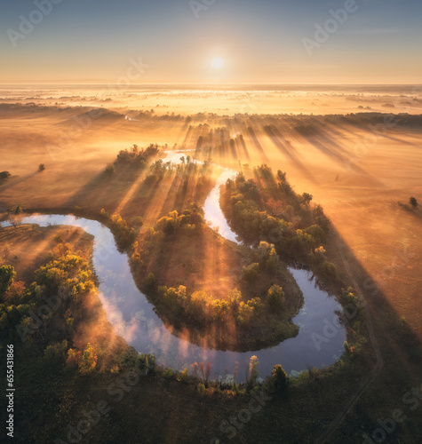 Valokuva Aerial view of beautiful curving river in low clouds at sunrise in autumn in Ukraine