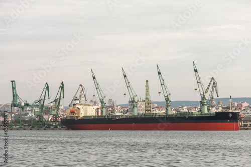 Varna, Black Sea port seaside view with moored bulk carrier