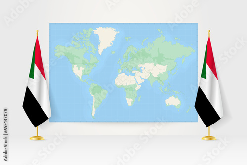 World Map between two hanging flags of Sudan flag stand.