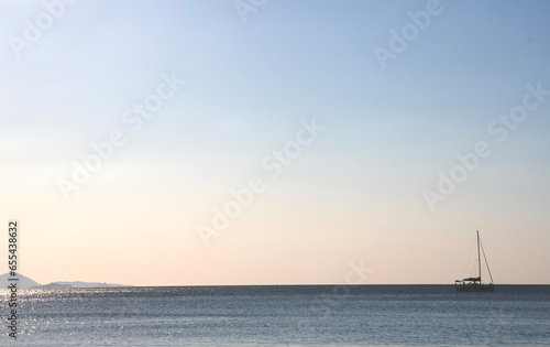 Boat at anchor at dawn. Gulf of Follonica. Italy.