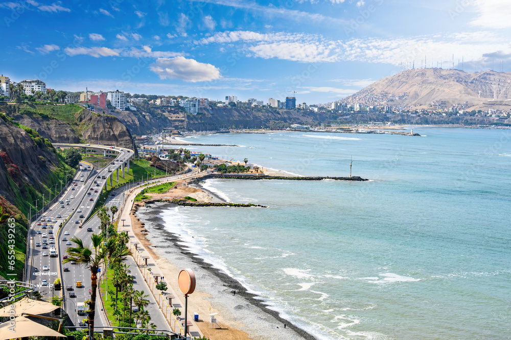View of Costa Verde Miraflores from the Pacific Ocean. In the background, Redondo Beach. Blue sky, green ocean and sunny day in 2023. - obrazy, fototapety, plakaty 