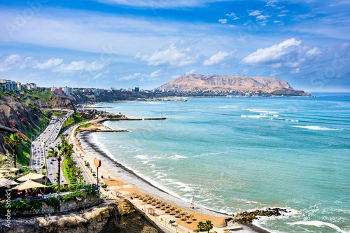 View of Costa Verde Miraflores from the Pacific Ocean. In the background, Redondo Beach. Blue sky, green ocean and sunny day in 2023.