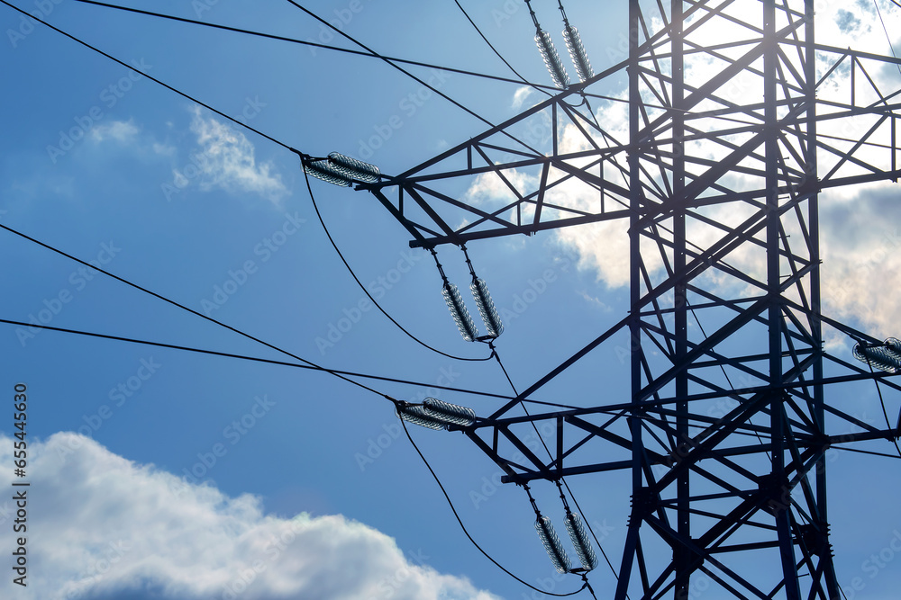 High voltage tower with electrical voltage wires isolates close-up ...
