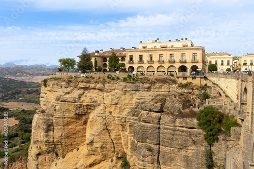 Panoramic view of Puente Nuevo Bridge at sunset in Ronda, Spain
