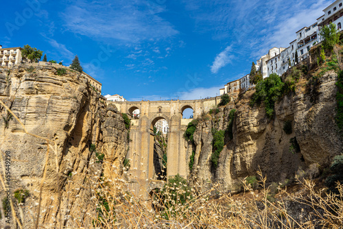 Panoramic view of Puente Nuevo Bridge at sunset in Ronda, Spain