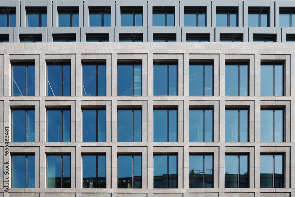 Outdoor exterior front view of modern facade with typical rectangular open and close windows.