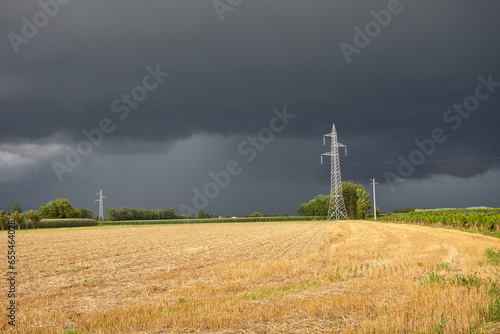 Power plant in field with thuderstorm © Nick