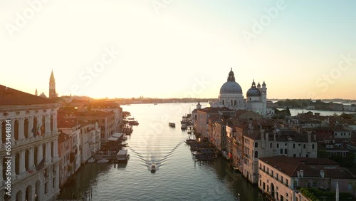 Establishing aerial view shot of Venice, early morning, sunrise, city skyline, Grand Canal, Santa Maria della Salute, Venetian Lagoon, Italy