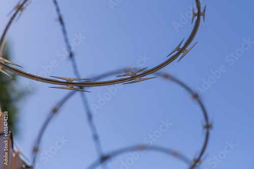 A close up view of concertina wire _ barbed wire as a security concept. 