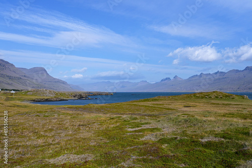 View of Berufjordur fjord and surrounding mountains from Ring Road in eastern Iceland on clear sunny autumn morning. photo