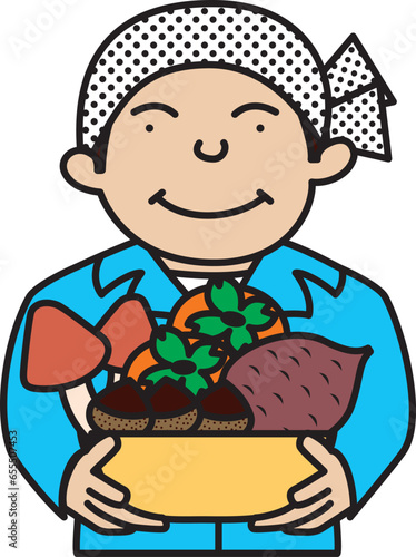 秋の収穫物をかごに入れて持っている農家の男性