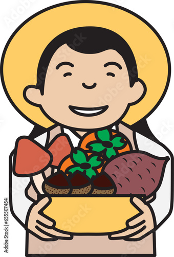 秋の収穫物をかごに入れて持っている農家の女性