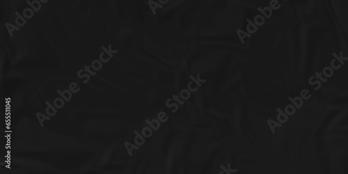 Dark crumple black paper wrinkled poster template ,blank glued creased paper texture background. black paper crumpled backdrop background. used for cardboard and clarkboard.