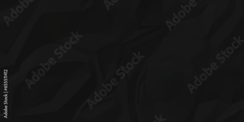 Dark crumple black fabric paper wrinkled poster template ,blank glued creased paper texture background. black paper crumpled backdrop background. used for cardboard and clarkboard.