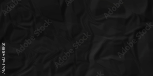 Dark crumple black fabric paper wrinkled poster template ,blank glued creased paper texture background. black paper crumpled backdrop background. used for cardboard and clarkboard.