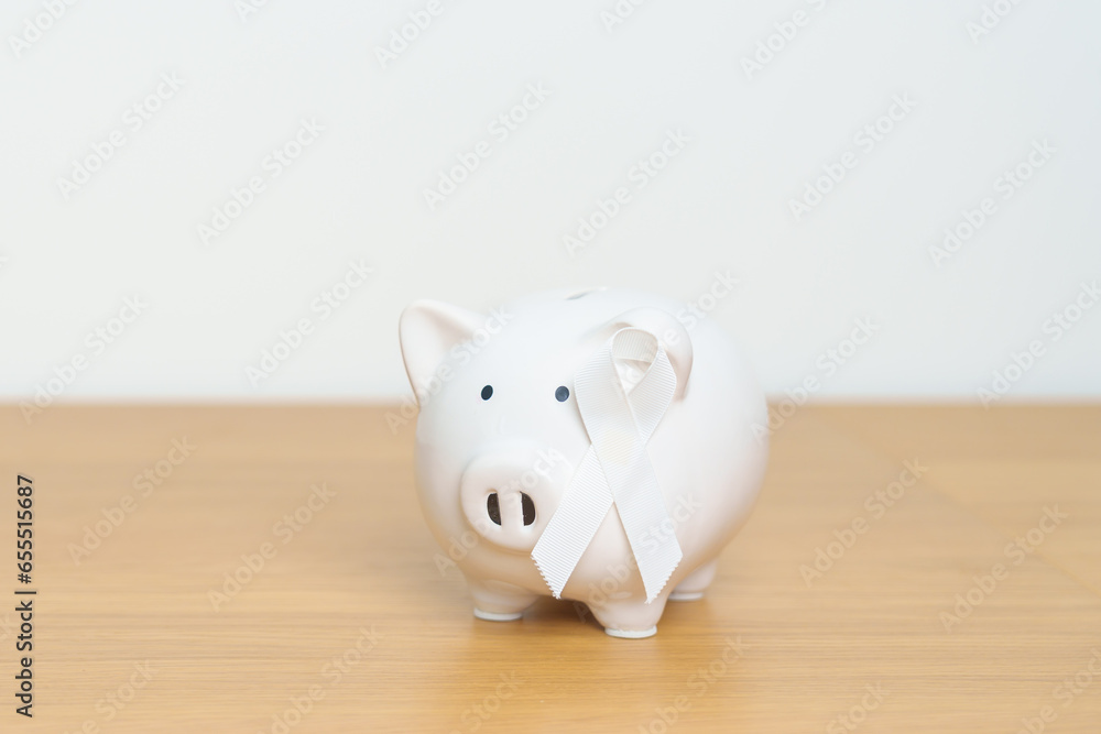 Fototapeta premium November Lung Cancer Awareness month, White Ribbon with Piggy Bank for support illness life. Health, Donation, Charity, Campaign, Money Saving, Fund and World cancer day concept