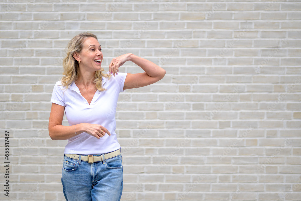 Upper body portrait of an attractive friendly woman looking to side Upper body portrait of an attractive friendly woman looking to side